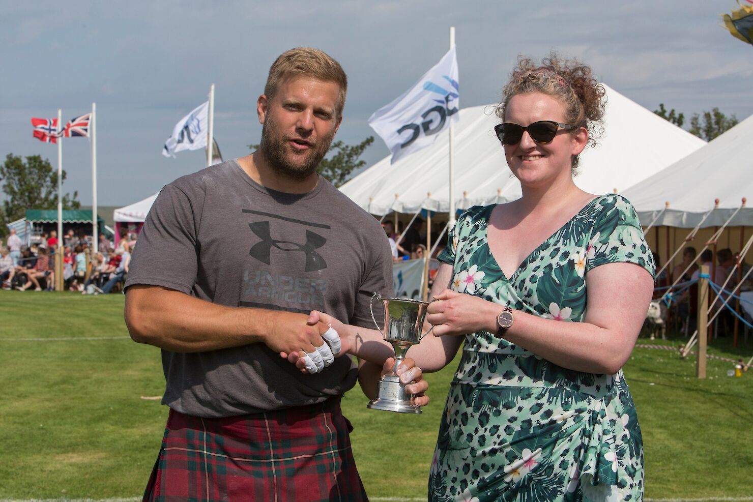 Lauren Cook (Senior Associate d and h) presenting winner Scott Rider with the Cup